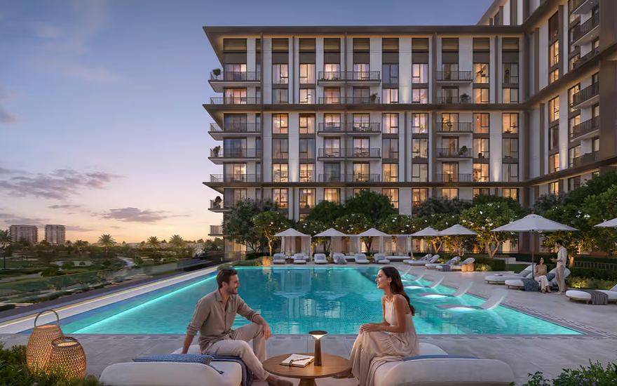 Golf Trails at Emaar South — poolside terrace overlooking the golf course at sunset