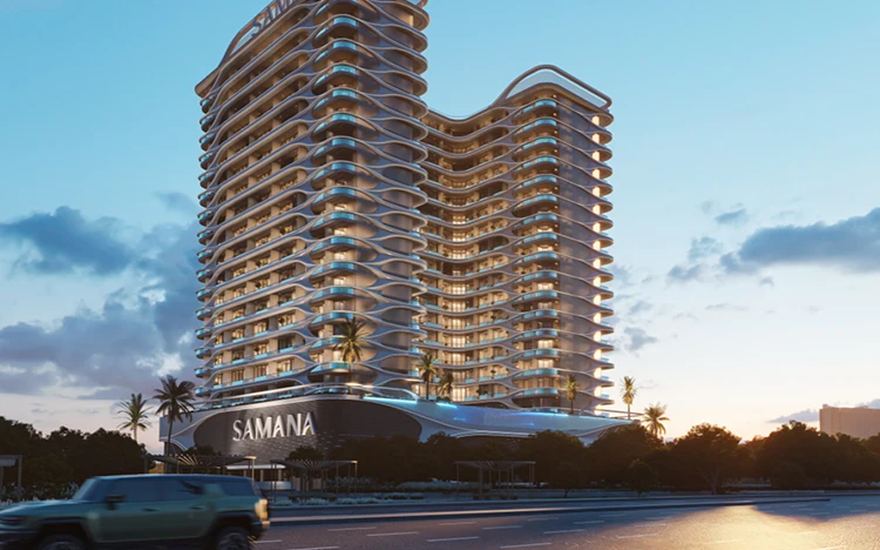 Samana Greenfield 2 — curved-balcony tower at dusk in International City 2